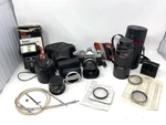 C) Konica Autoreflex Camera W/several Hexanon Lenses, Vivitar Flash & Case. Fixed Price $85.00.