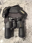 Nikon Action 12X50 5.5 Binoculars Complete With Strap, Case And Lens Covers. Fixed Price $74.99.