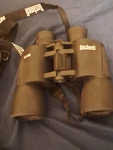Black Bushnell 10X50MM Binoculars Uline W. Case And Strap. Fixed Price $19.00.