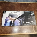 The Sharper Image Power Tie Motorized Rack New Open Box Whisper Quiet Look. Fixed Price $45.00.