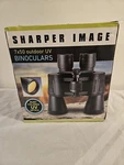 Sharper Image 7X50 Binoculars W/ruby Colored Uv Optics Nib New Condition. Fixed Price $39.99.