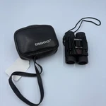 Tasco 8 X 21 Compact Folding Binoculars With Black Barrels & Standard Neck Strap. Fixed Price $10.00.