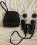 Tasco 7X35 Binoculars Model 304 Fully Coated 346 Ft 1000 Yds W/ Leather Case. Fixed Price $12.00.