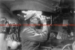 F028735 German Assault Gun Commander Looks Through Binoculars Via Cupola Perisco. Fixed Price $6.75.