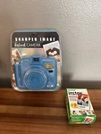 Sharper Image Instant Camera With Flash, Model 1009078 New - Blue W/ Film. Fixed Price $39.75.