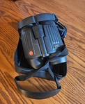 Leica Binoculars 10X42 Ba, Optics, Black, Preowned With Case. Fixed Price $700.00.