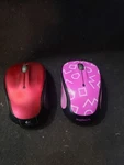 Logitech Red And M325C Purple - Wireless Optical Mouse Both Have Dongles. Fixed Price $24.95.