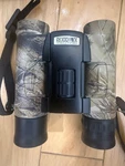 Nikon Binoculars 10X25 - Degrees Realtree Camo, Outdoors + Case, Neck Strap. Fixed Price $39.99.