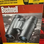 Bushnell 10X42MM Binoculars - Black. Fixed Price $100.00.