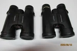 Celestron Outland Binoculars One Is 10X42 Other Are 8X42 Used. Fixed Price $75.00.