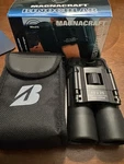 Magnacraft 10X25 Binoculars SPB10257 With Neck Strap And Carry Case. Fixed Price $20.00.