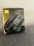 Nikon BINOCULARS10X25 Travelite #7278-BLACK. Fixed Price $124.99.