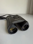 Steiner Binoculars 8X22 Predator With Bushnell Case. Fixed Price $75.00.